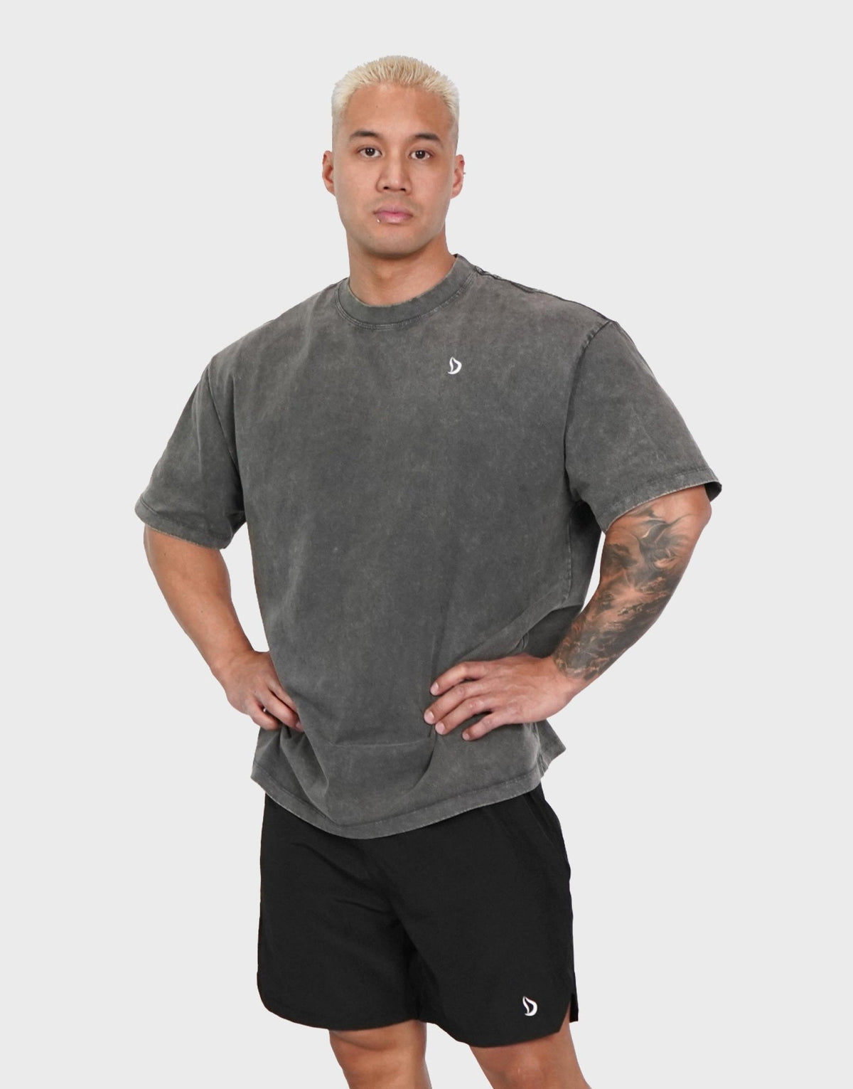 Lifter wearing the Devoteewear Power Play Oversized Shirt in Dark Grey