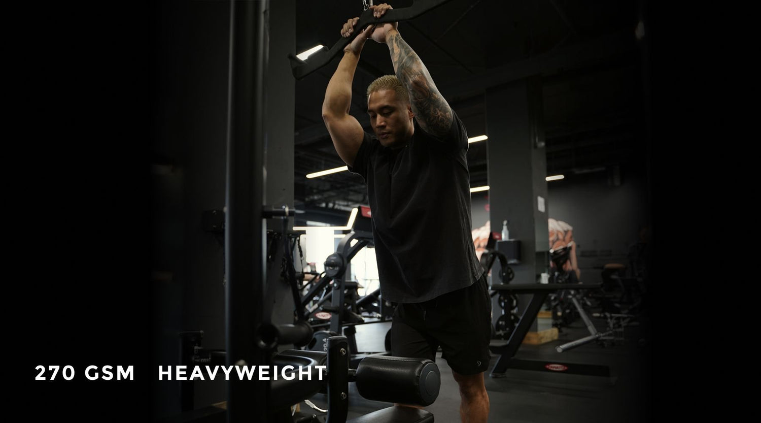 Lifter wearing the Power Play 270 GSM heavyweight oversized shirt during a cable training set